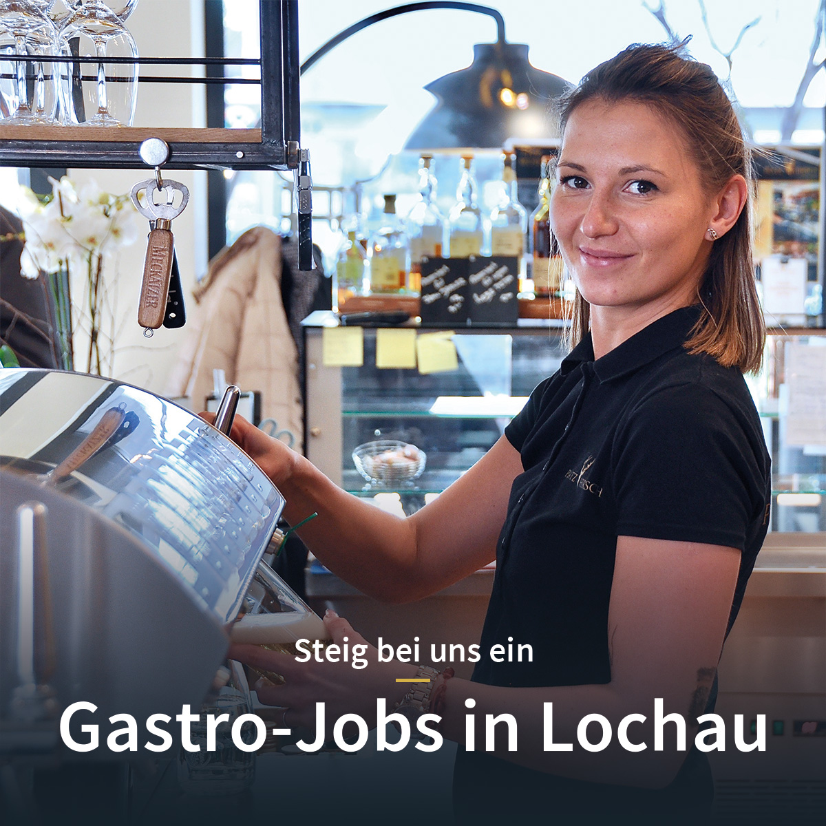 Inside view of Platzhirsch Café, with a girl wearing the café uniform filling a glass with beer at the counter, offering a friendly service and a welcoming atmosphere.